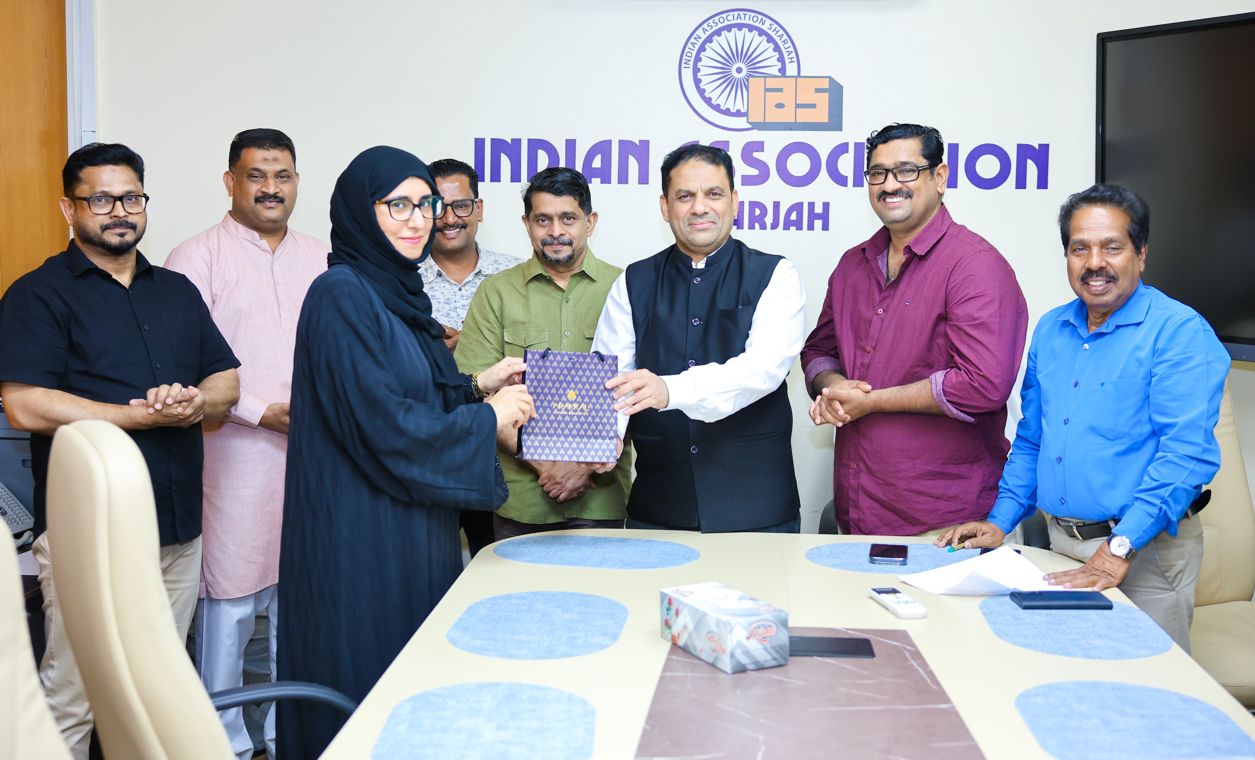 Community member presenting Joyalukkas gift