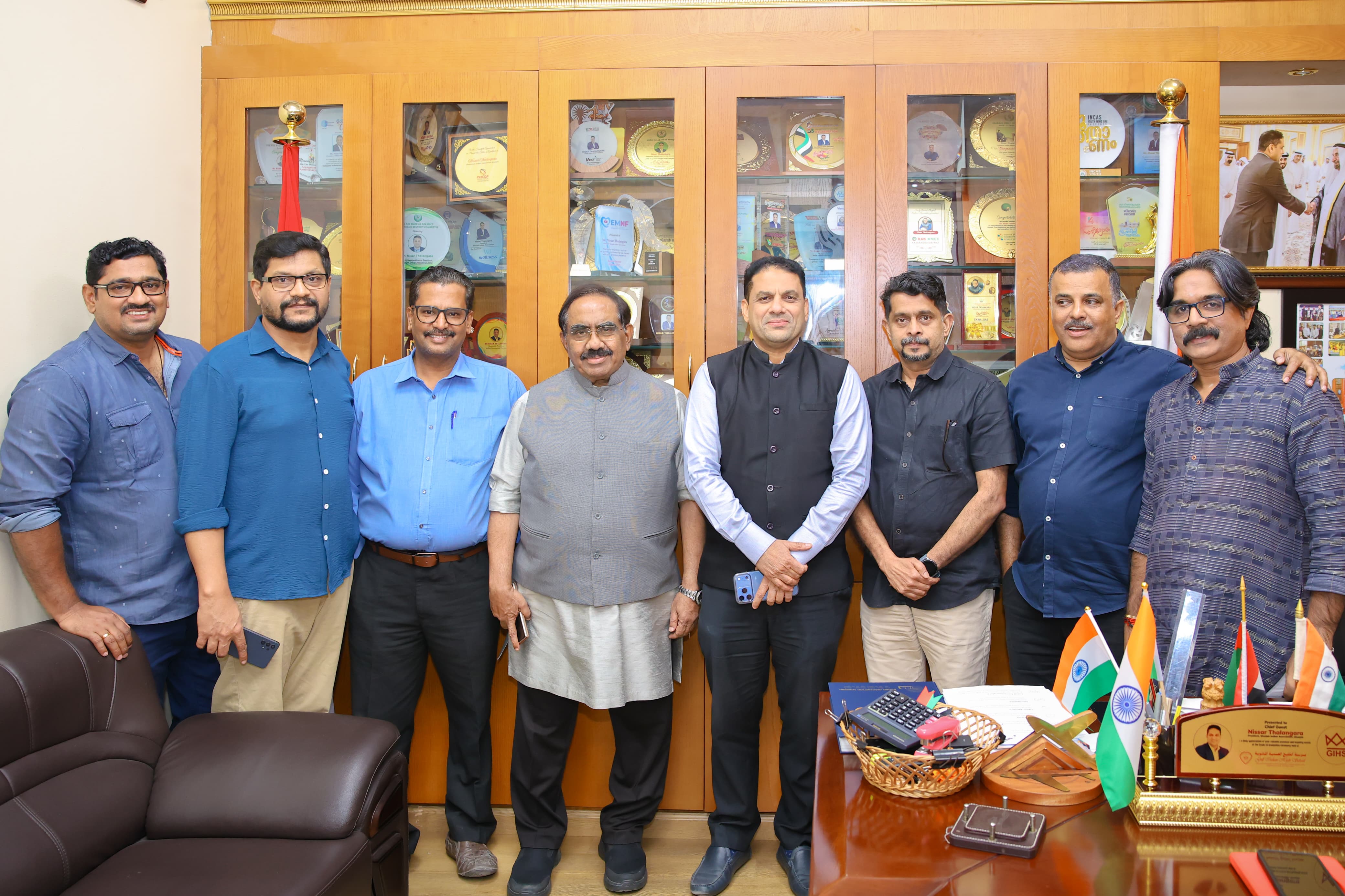 Group meeting with trophies and awards display